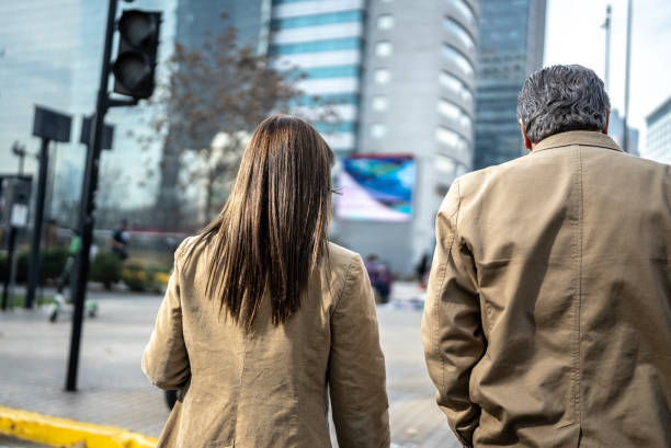 istock Coworkers walking and talking outdoors 1405261465