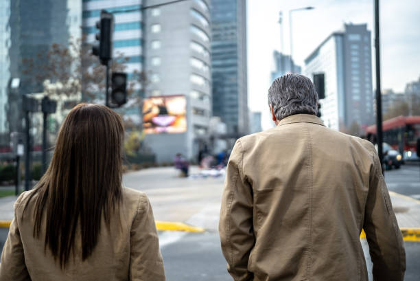 istock Coworkers walking and talking outdoors 1405261475