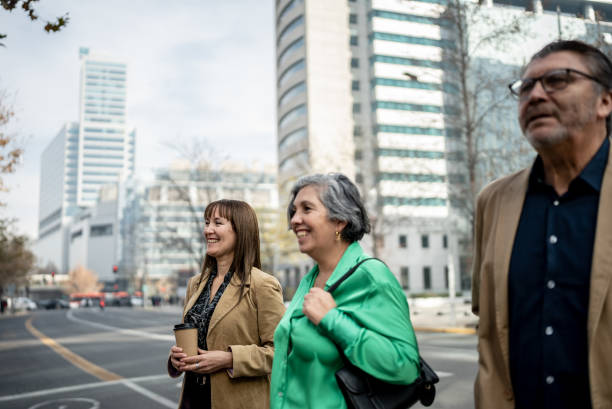 istock Coworkers walking and talking outdoors 1405261483