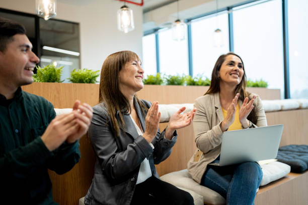 istock Audience applauding after team meeting or seminar 1405261609