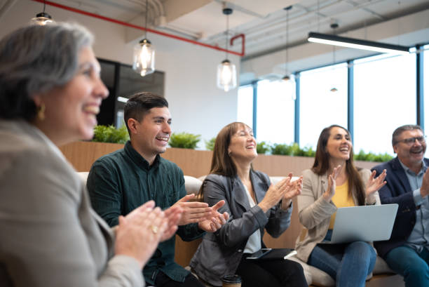 istock Audience applauding after team meeting or seminar 1405261697