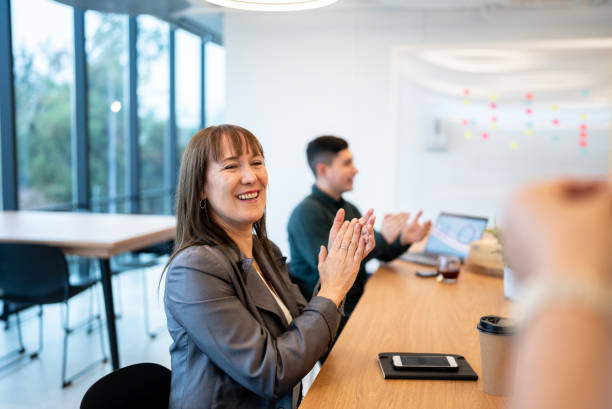 istock Audience applauding after team meeting or seminar 1405262662