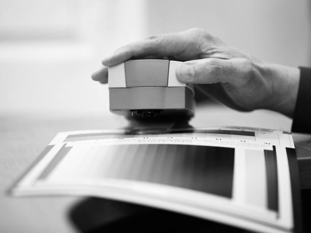 istock man calibrates photo paper before printing 1405263201