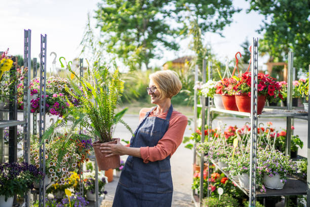 istock Woman nurturing plants and flowers 1405264481