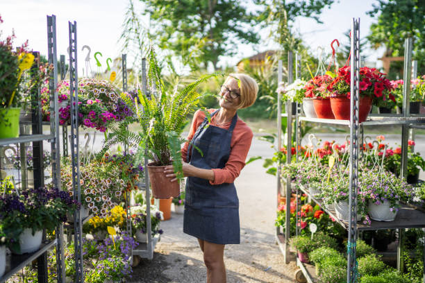 istock Woman nurturing plants and flowers 1405264507