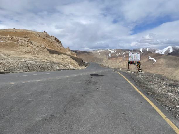 istock Empty road view with mountain in the background 1405265063