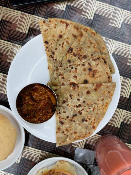 istock Indian style stuffed parantha (bread) with pickles 1405265195