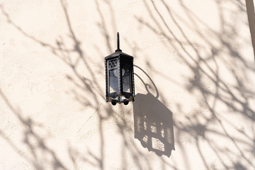street lamp lantern on wall with shades.