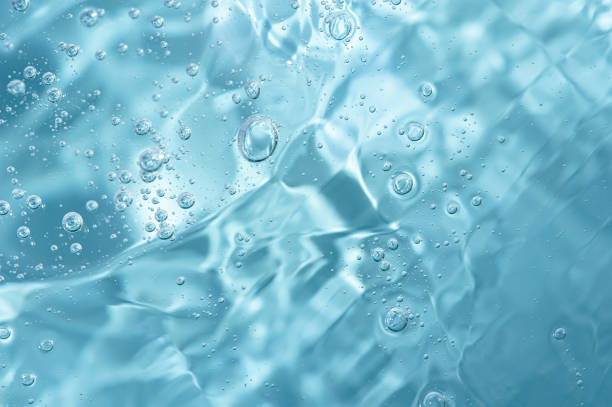 istock Close up macro Aloe vera gel cosmetic texture blue background with bubbles. 1405265666
