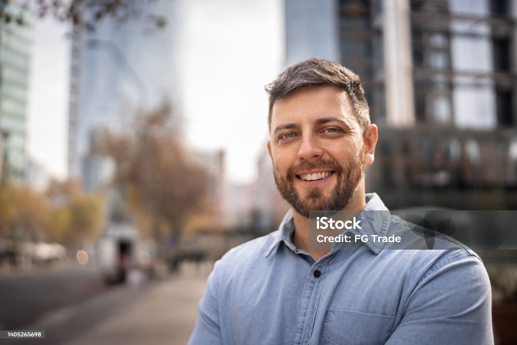 Portrait of mid adult man outdoors Men Stock Photo