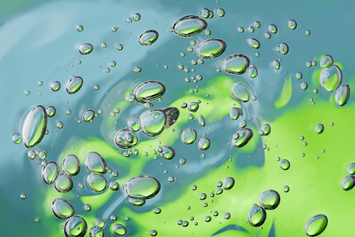 Water drops in green background