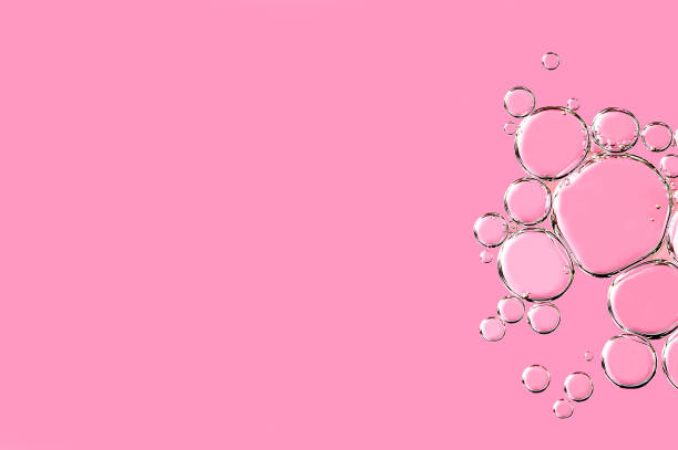 istock Close up macro Aloe vera gel cosmetic texture pink background with bubbles. 1405265901