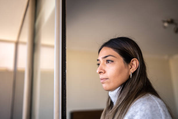 istock Woman contemplating at home 1405266696