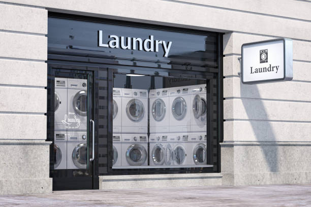 istock Laundry building exterior with washing machines inside it. 1405266801