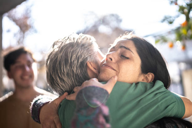 istock Mother welcoming daughter at home 1405267452