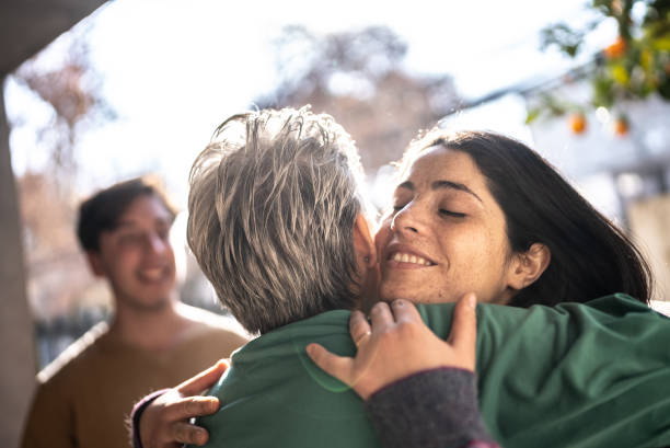istock Mother welcoming daughter at home 1405267453