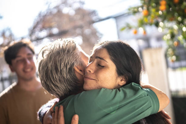 istock Mother welcoming daughter at home 1405267480