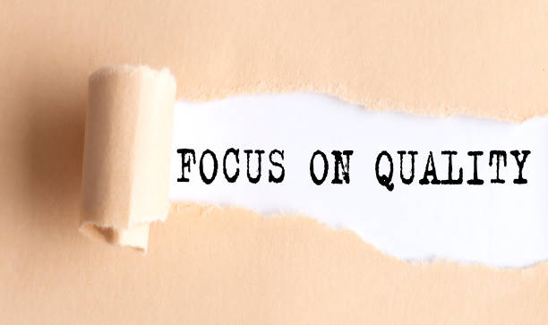 istock The text FOCUS ON QUALITY appears on torn paper on white background. 1405268343
