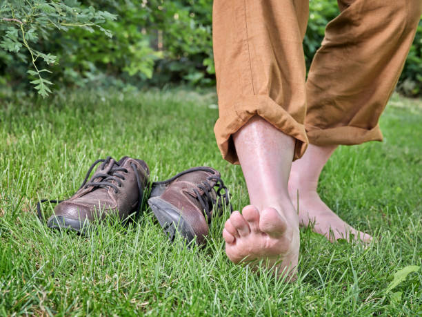 Barefoot walking, earthing and grounding concept stock photo