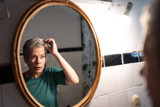 istock Mature woman getting ready at home 1405269419