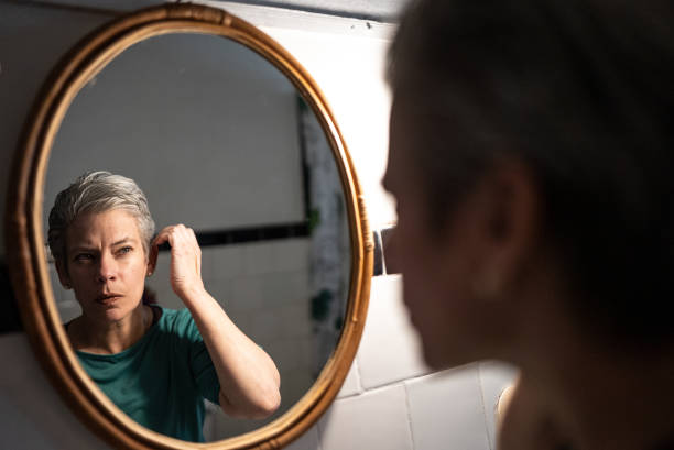 istock Mature woman getting ready at home 1405269432