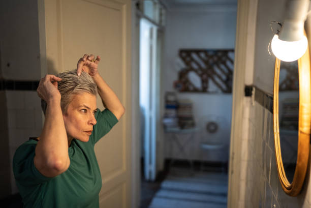 istock Mature woman getting ready at home 1405269436