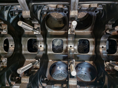 Engine parts, Machine Valve, Engine Block, Cylinder, Chrome material, Machine Parts. Valve in a deposit on the removed cover of the engine valve box. Destroyed engine block.