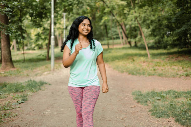 istock Beautiful, happy Indian jogging in the park 1405271448