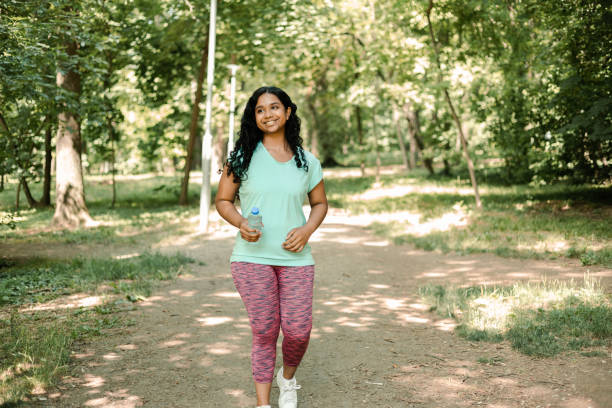 istock Happy female Indian enjoying jogging 1405271458