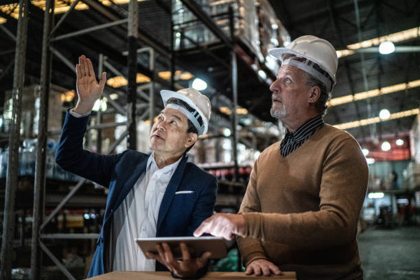 istock Businessmen doing a meeting in a warehouse 1405272160