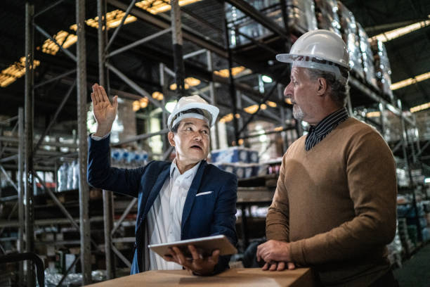istock Businessmen doing a meeting in a warehouse 1405272183
