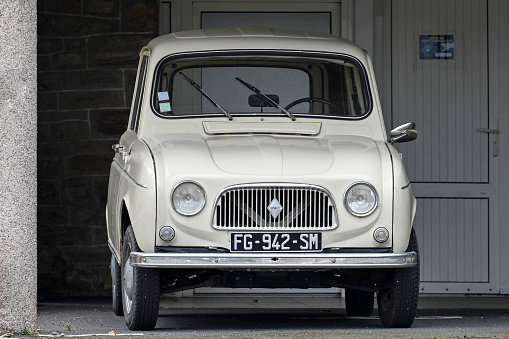 Erquy, Bretagne, France - June 25, 2022 - a Renault 4 from 1966 in a parking lot. The Renault 4 - short R4 - is a French small car of Renault and was produced from summer 1961 to end of 1992.