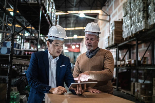 istock Businessmen doing a meeting in a warehouse 1405272256
