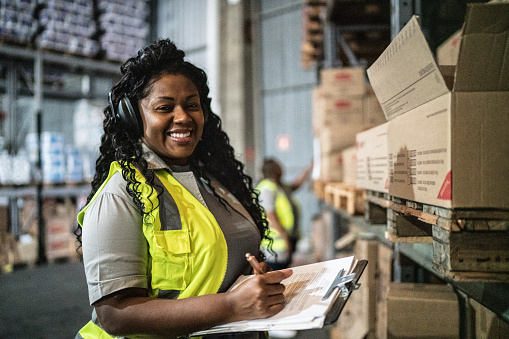 Portrait of a warehouse worker with a clipboard