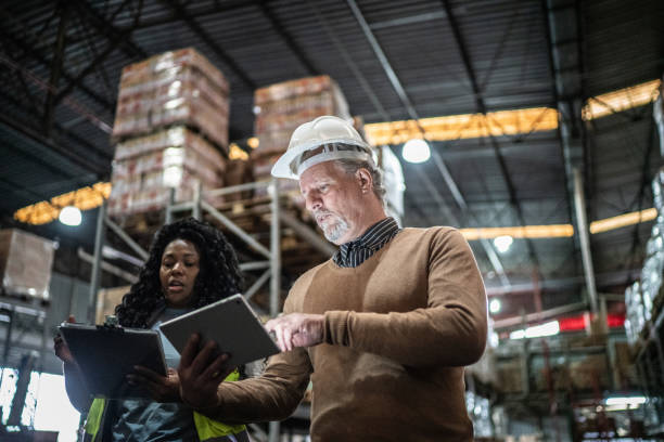 istock Warehouse inspector and manager doing an informal meeting 1405272356