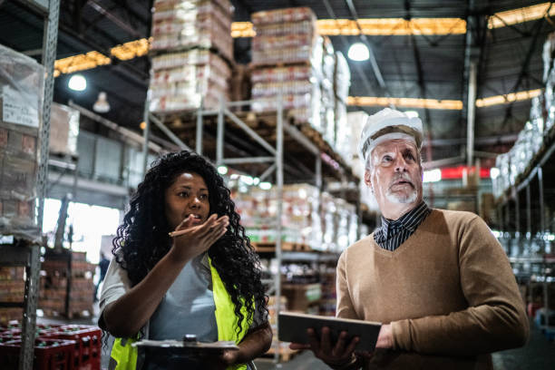 istock Warehouse inspector and manager doing an informal meeting 1405272468