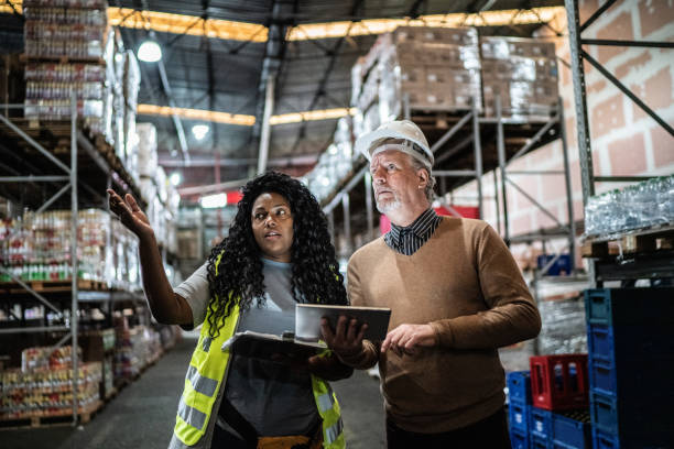 istock Warehouse inspector and manager doing an informal meeting 1405272577
