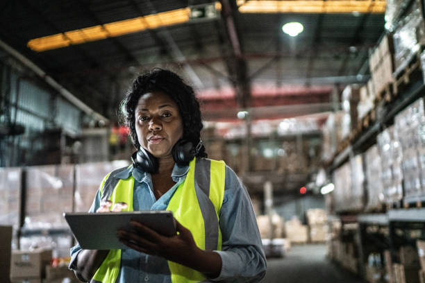 istock Portrait of a woman using digital tablet in a warehouse 1405273657