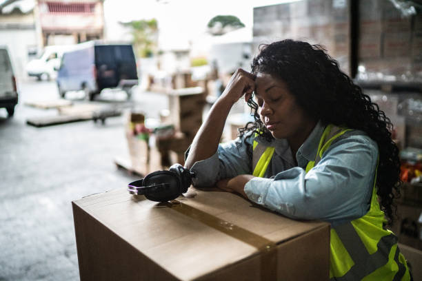 istock Tired or worried female warehouse worker 1405273697