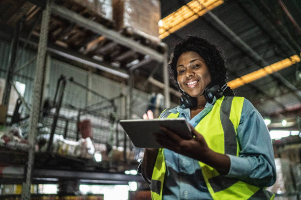 istock Portrait of a woman using digital tablet in a warehouse 1405273706