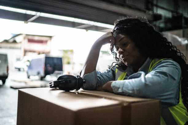 istock Tired or worried female warehouse worker 1405273726