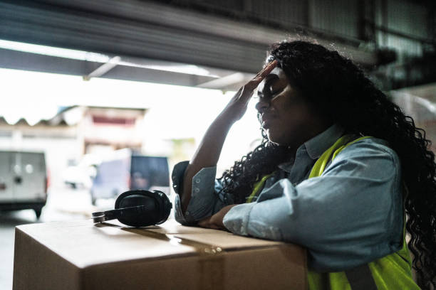 istock Tired or worried female warehouse worker 1405273774