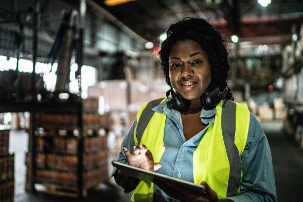 istock Portrait of a woman using digital tablet in a warehouse 1405273777