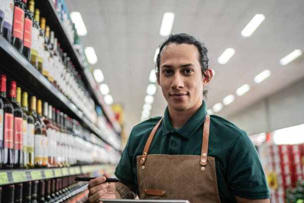 istock Portrait of a non-binary person working in a supermarket 1405275384