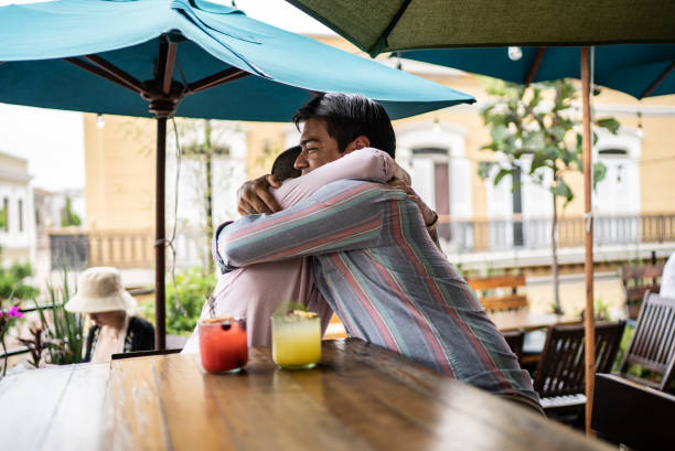 istock Gay couple embracing on a bar 1405279396
