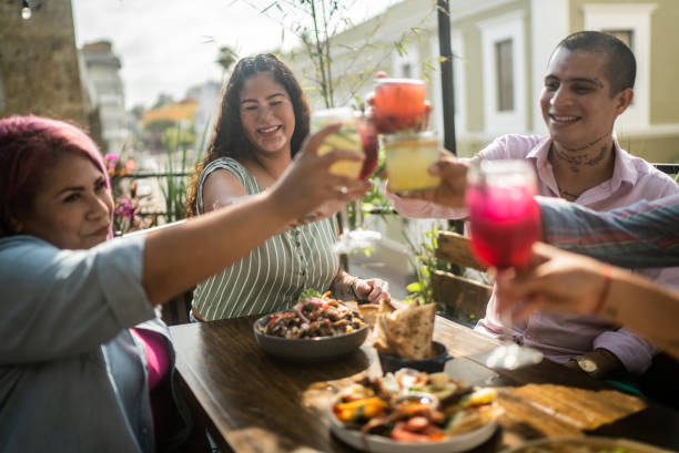 istock Friends on a celebratory toast at a restaurant 1405280557