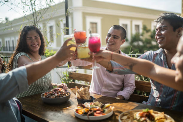 istock Friends on a celebratory toast at a restaurant 1405280568