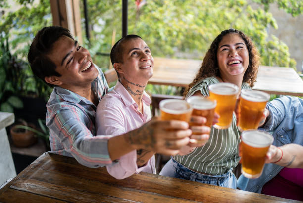 istock Friends drinking beer and doing a celebratory toast at a bar 1405281597