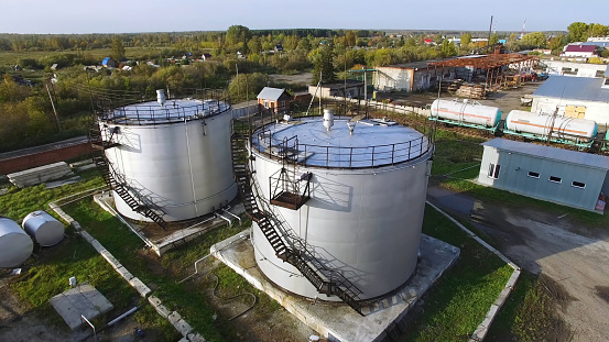 Aerial top view oil storage tanks. Stock. Top view of the large oil tanks.