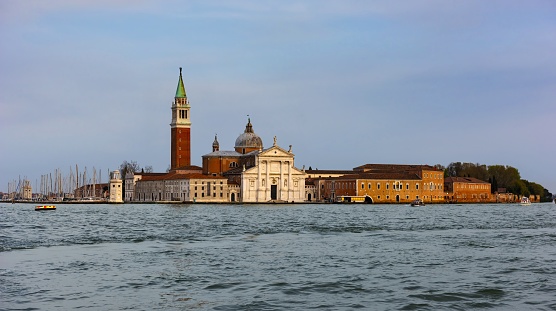 Venice, Italy, April 2, 2016: View of the Church San Giorgio Maggiore on the island of the same name on early evening. The entire Venetian Lagoon is listed as UNESCO World Heritage Site.
